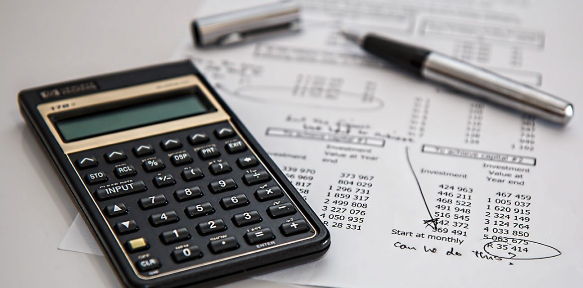 A calculator, a pen and a receipt